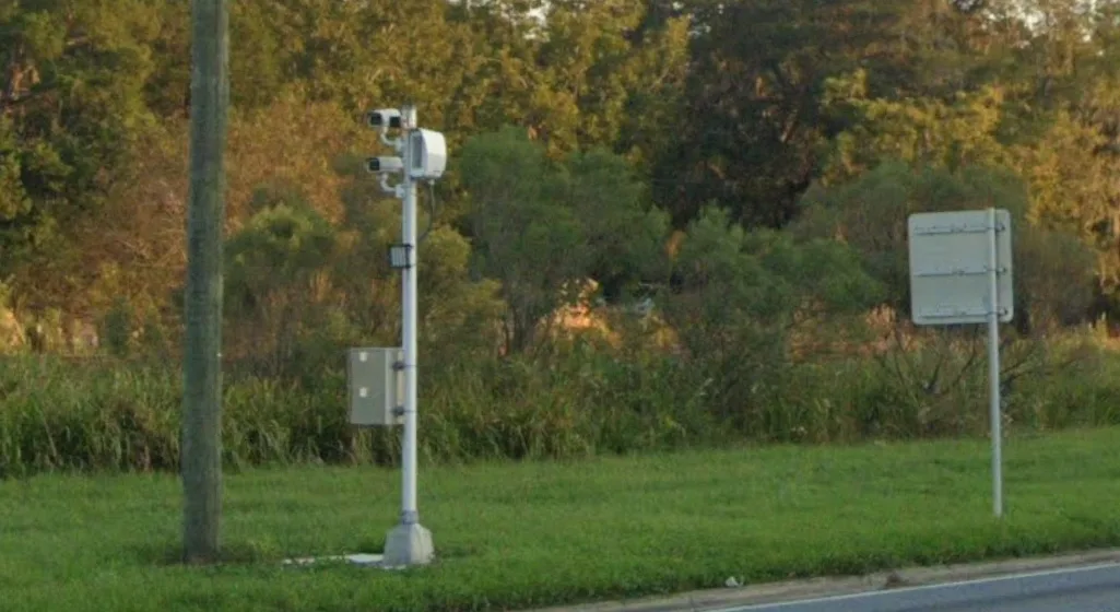 RedSpeed school zone speed camera pole on the roadside in Lawtey Florida